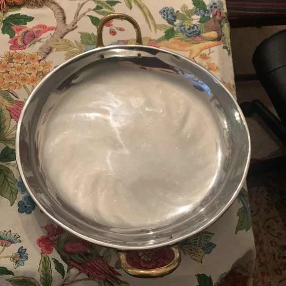 Stainless steel? Brass handle huge trays? Skillets? Made in Mexico